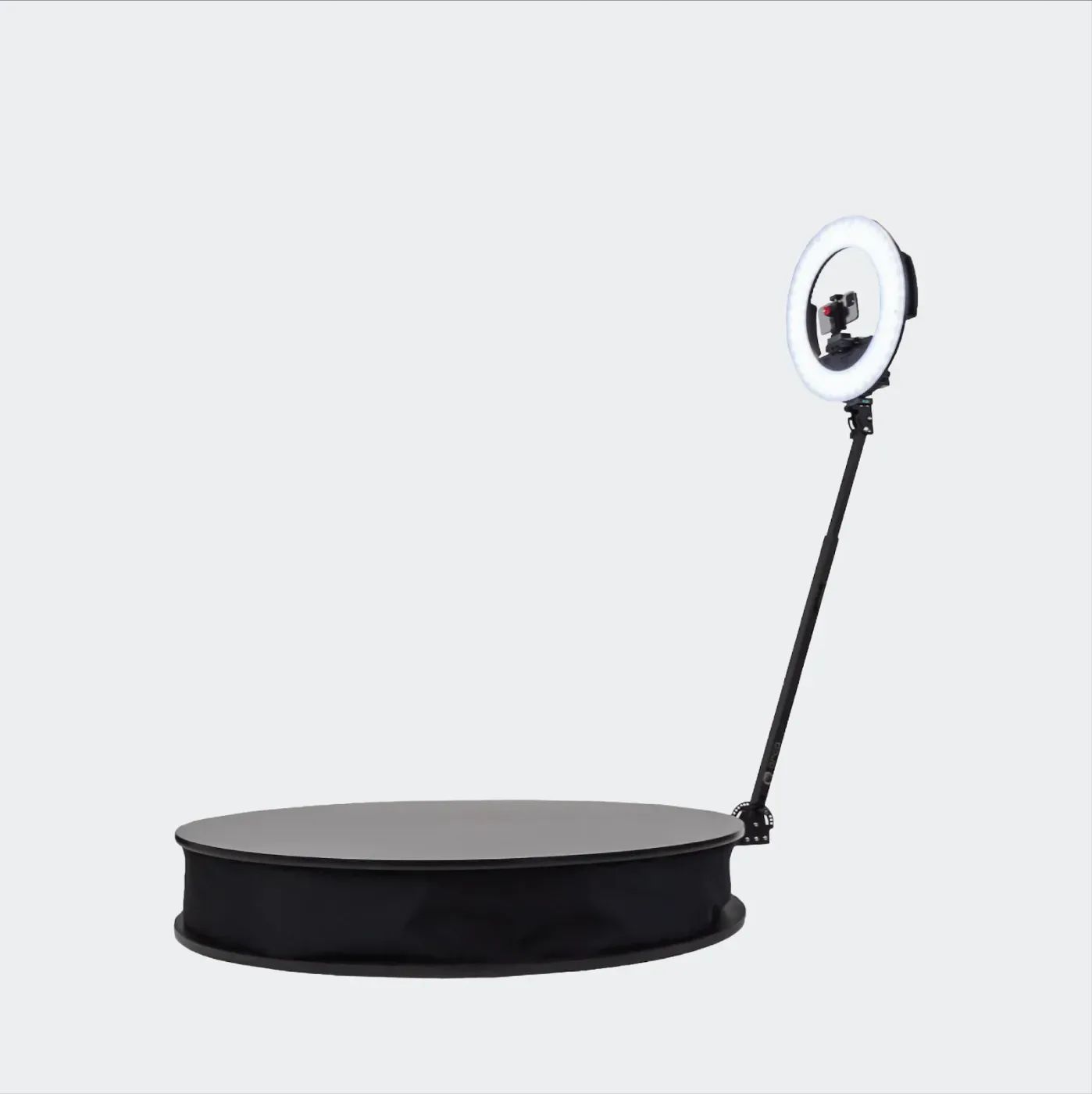 360 photo booth: a low round spin platform with a central camera arm, ready for guests to step on.
