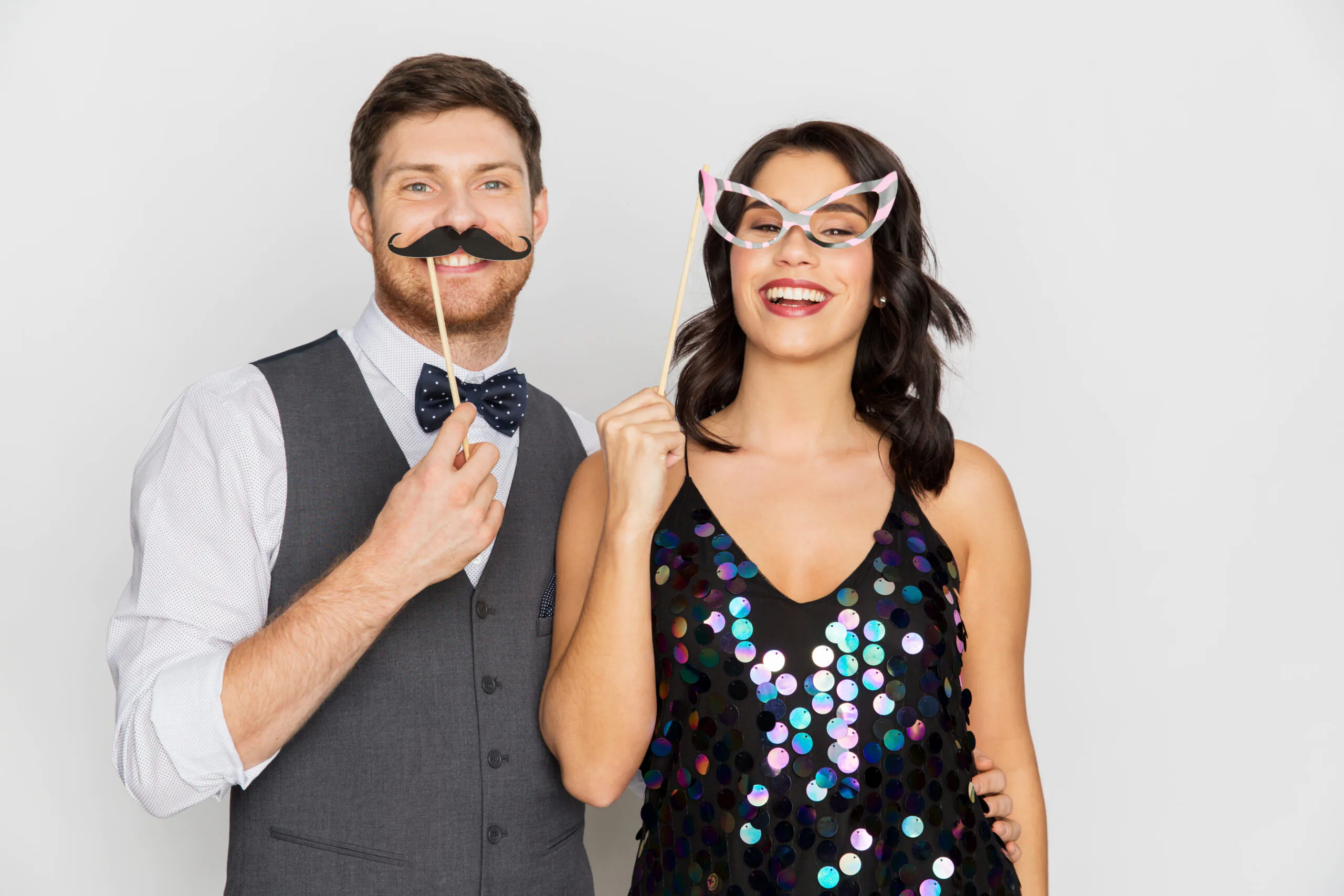 happy couple with party props having fun